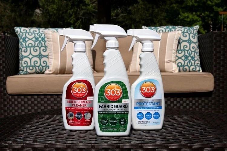 303 fabric, surface cleaner and protectant bottles beside outdoor furniture